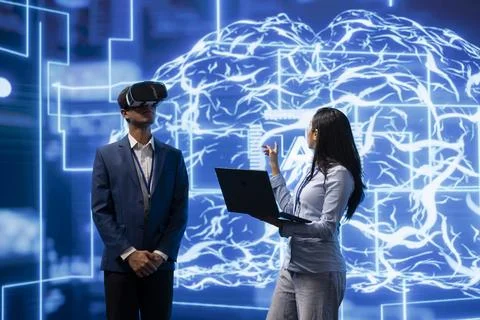 Team of developers interacting with AI visualization using VR Stock Photos