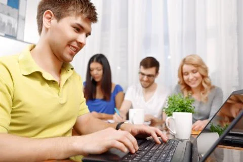 Team of developers making notes and discussing the project Stock Photos