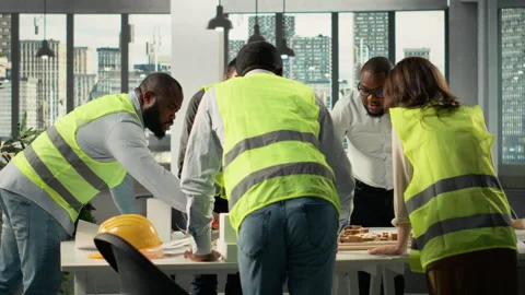 Team of developers in modern office environment planning construction Stock Footage 320029586