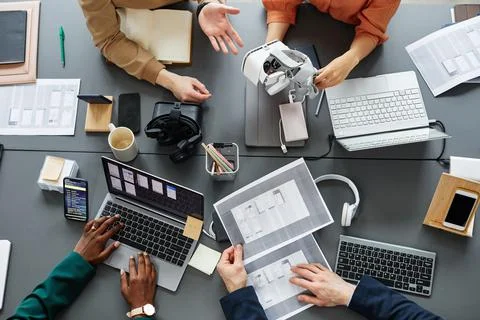 Team of developers testing VR glasses application Stock Photos