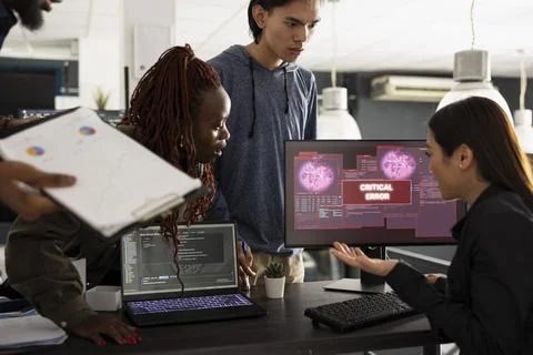 Team of developers working anxiously to resolve unexpected critical error 스톡 사진