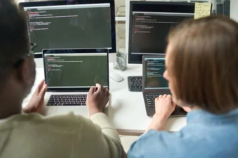 Team of developers working on new software program 写真素材