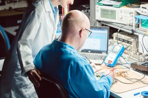 Team of development engineers designing new product in the lab 스톡 사진