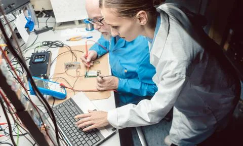 Team of development engineers designing new product in the lab Stock Photos