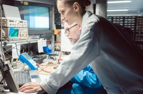 Team of development engineers designing new product in the lab 스톡 사진