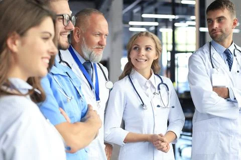 Team of different doctors having conversation in hospital. Stock Photos
