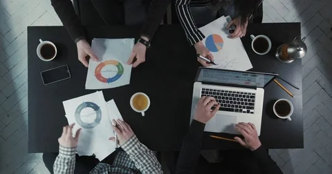 The team is discussing the business problems and drinking tea at the low speed Stock Footage 76395447