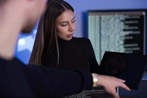 Team discussing cybersecurity issues in a modern SOC environment 写真素材
