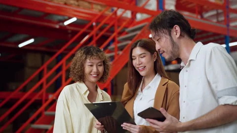 Team Discussing Warehouse Operations on Tablet. Stock Footage 278428422