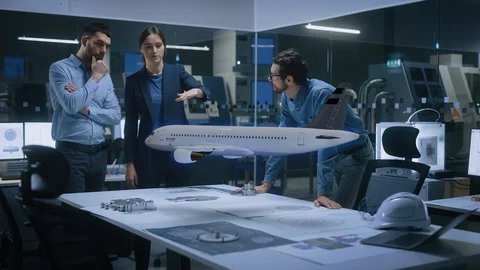 Team of Diverse Engineers and Managers Work on an Augmented Reality Airplane Stock Footage 128854462