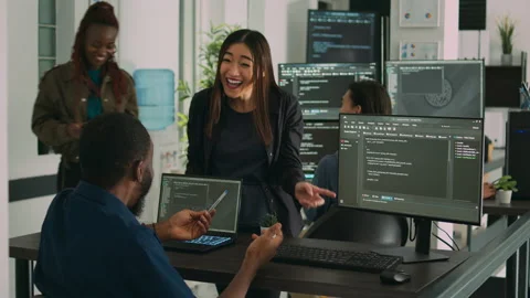 Team of diverse programers doing highfive gesture after coding database Stock Footage 217409084