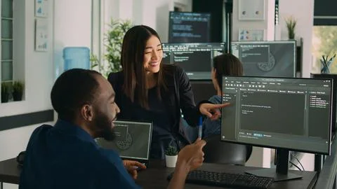 Team of diverse programers doing highfive gesture after coding database 스톡 사진