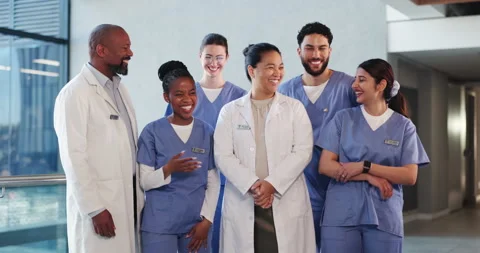 Team, diversity and laughing with doctors in hospital for solidarity, joke or Stock Footage 321832558