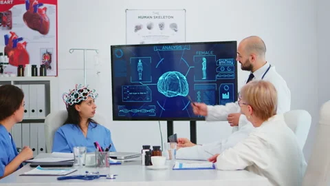 Team of doctors analysing brain functions using high tech 動画素材 144618266