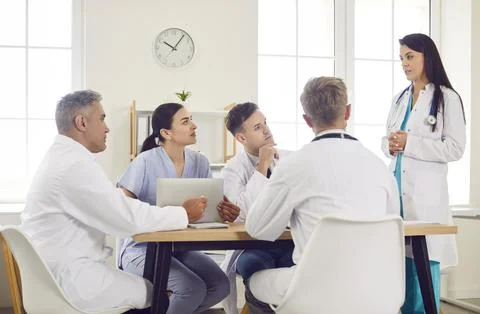 Team Of Doctors And Nurses In Group Meeting At Hospital Stock Photos