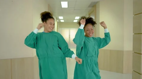 Team of doctors, nurses and assistants dancing after successful do surgery Stock Footage 189909215