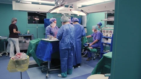 Team of doctors in the operating room Stock Footage 128748025