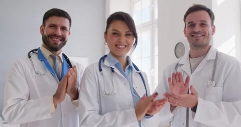Team Of Doctors Or Nurses Clapping And Celebrating Success In Hospital Stock Footage 321385431