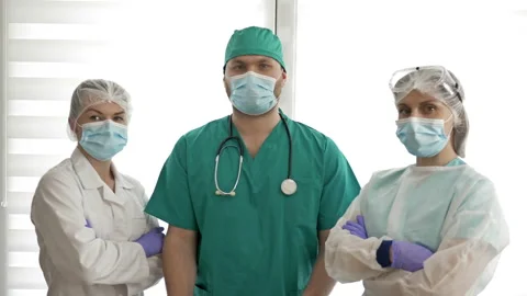 Team of doctors with poster COVID-19. Video stock 129602673