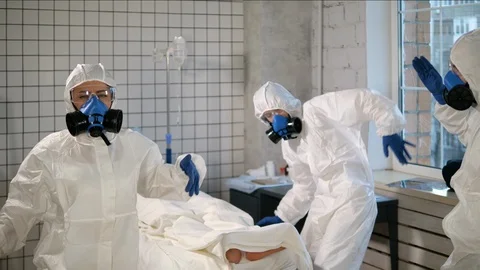 Team of Doctors in protective suits dancing in the hospital chamber. Stock Footage 127265262