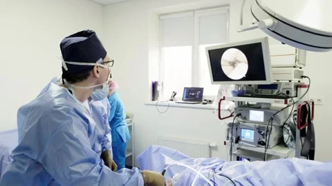 A team of doctors - surgeons performing a surgical operation Stockbeeldmateriaal 269432415