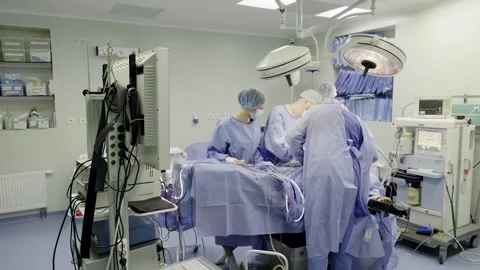 A team of doctors - surgeons performing a surgical operation Stockbeeldmateriaal 269437877