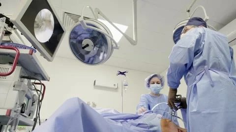 A team of doctors - surgeons performing a surgical operation Stockbeeldmateriaal 269481126