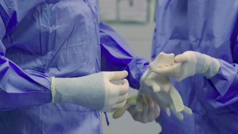 A team of doctors - surgeons performing a surgical operation Stock Footage 270482976