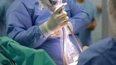 Team of doctors using laparoscopy camera surgery robot in surgical room in ho 動画素材 102223644