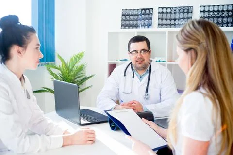 Team of doctors at working place Stock Photos