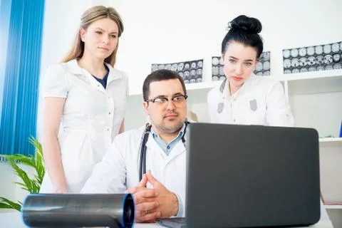 Team of doctors at working place Stock Photos