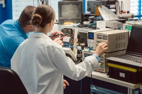 Team of electronic engineers testing a product prototype Stock Photos