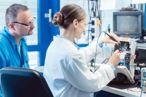 Team of electronic engineers testing a product prototype Stock Photos