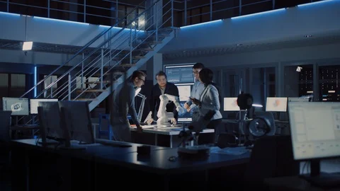 Team of Electronics Development Engineers Standing at Desk Working on Robot Arm Stock Footage 104598021