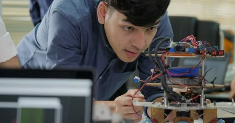 Team of electronics engineer working together, collaborating on a project to Video stock 94645942