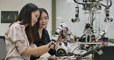 Team of electronics engineer works with robot. Stock Footage 111822307