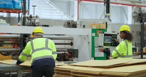 Team engineer controlling machine at factory. Stock Footage 249988403