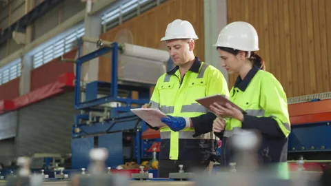 Team engineer examining and measuring steel together with expertise at factory. Stock Footage 228858720
