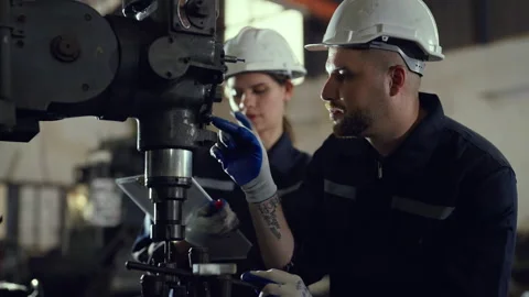 Team engineer examining and measuring steel together at factory Video stock 228863341