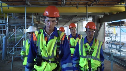 Team engineer metalworker in protective helmet uniform going refinery Видео 252714788
