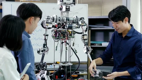 Team engineer start up for robot project together. Stock Footage 94103187