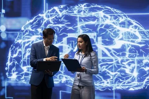 Team of engineers analyzing AI models Stock Photos