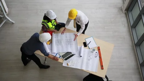 Team of engineers and architects working, planing, measuring layout of buildi Stock Footage 162376150