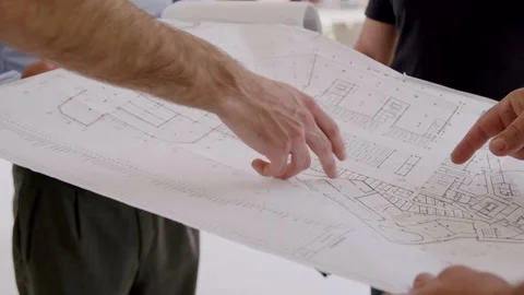 The team of engineers and architects working, measuring, planning the Stock Footage 245846287