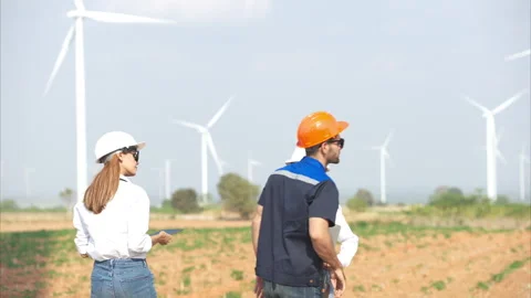 Team of engineers and architects working on wind turbines Stock Footage 264134224