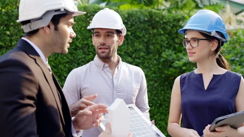 Team of engineers and businessmen have meeting on construction of solar cell Stock Footage 155343892