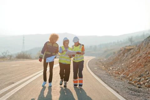 A team of engineers and workers oversees a wind Stock Photos