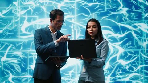 Team of engineers brainstorming ways to develop AI Stock Photos