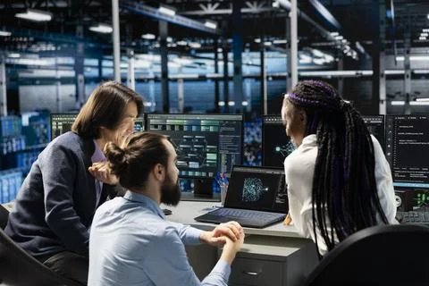 Team of engineers in data center doing brainstorming, troubleshooting using AI Stock Photos