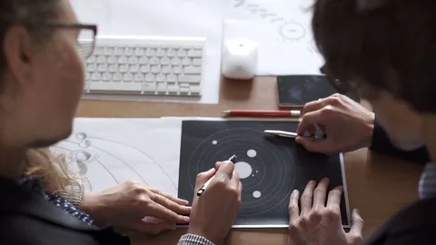 A team of engineers discussing a flight into space Stock Footage 80726090